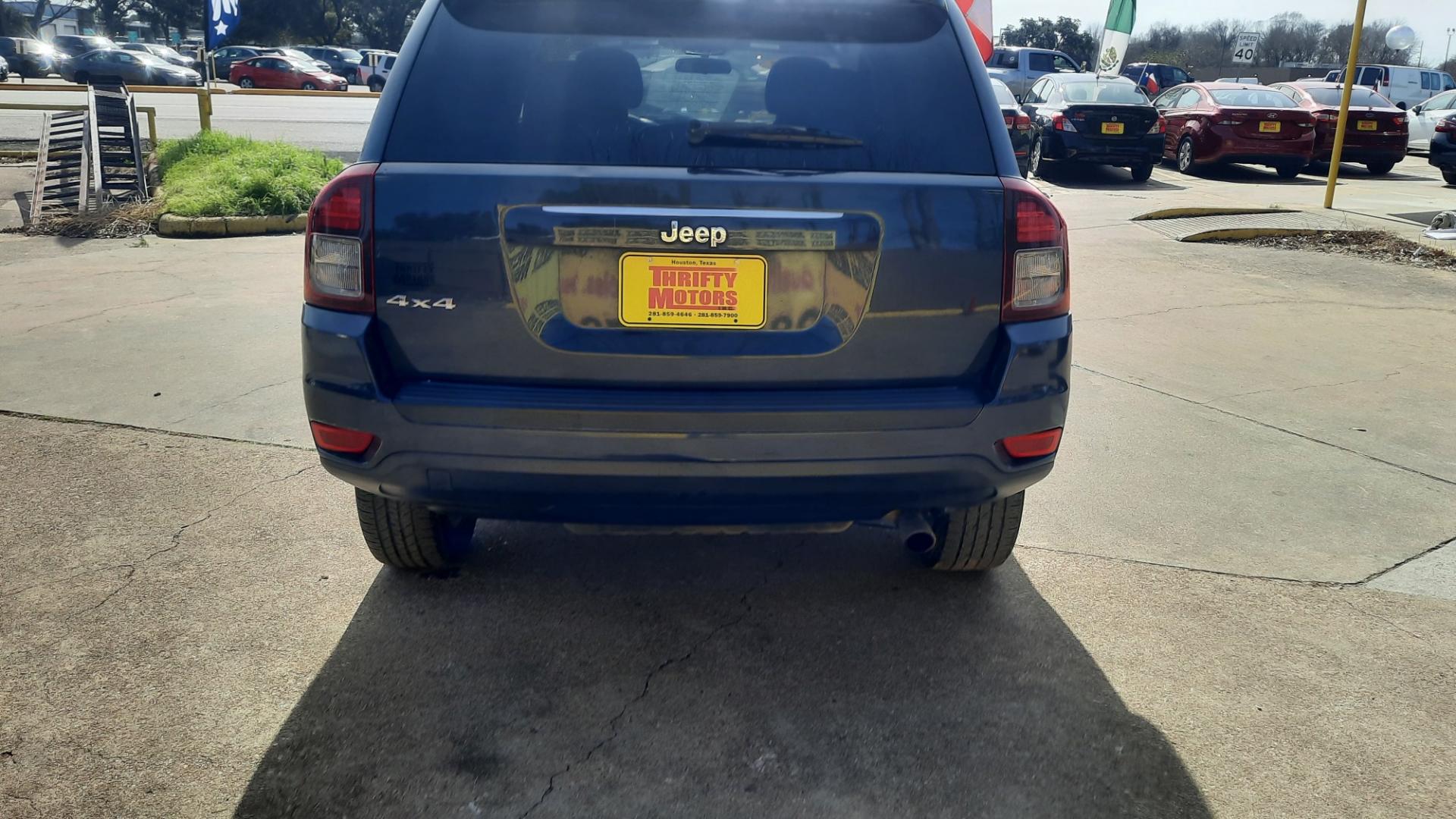 2014 Jeep Compass (1C4NJDBBXED) , located at 16710 Clay Rd., Houston, TX, 77084, (281) 859-7900, 29.834864, -95.656166 - Photo#3